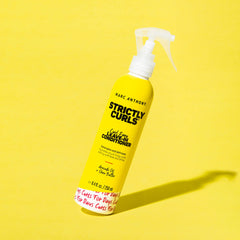 Marc Anthony being sprayed on damp hair for detangling and softening