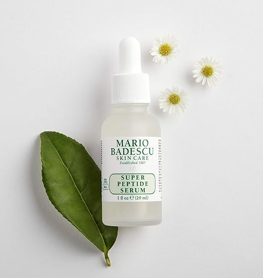Label close-up on Mario Badescu bottle listing peptides and botanical extracts
