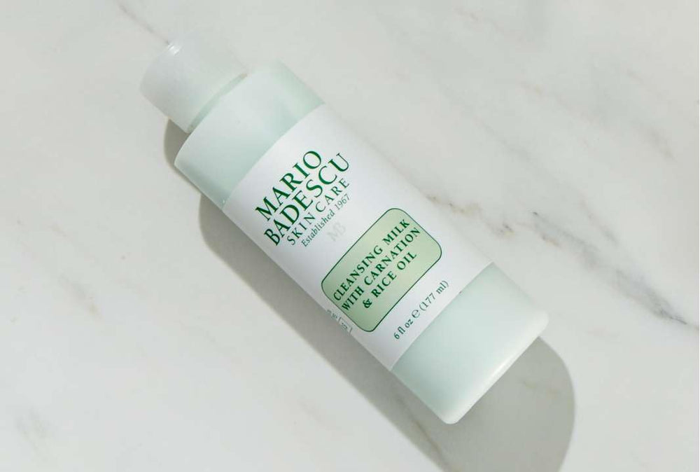 Mario Badescu cleansing milk in use wiping makeup, demonstrates gentle removal