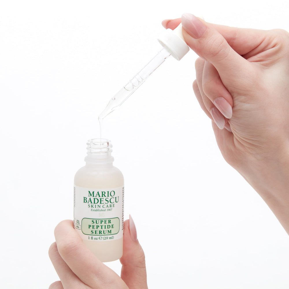 1 fl oz Mario Badescu bottle beside ruler for size and travel-friendly benefit
