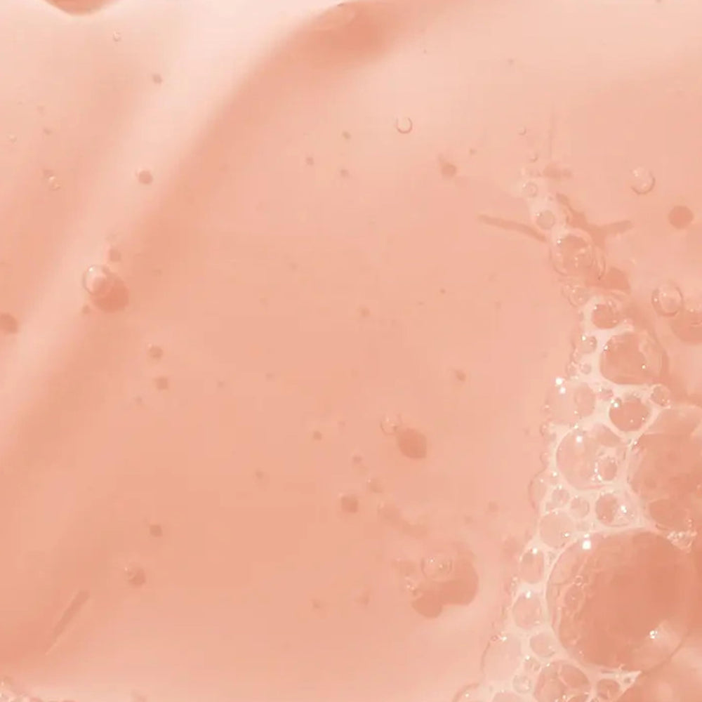 Mario Badescu bottle with rose petals and ingredients suggesting hydration