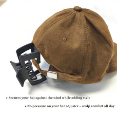 Markuii clip holding hair with a sunhat in a beach outfit