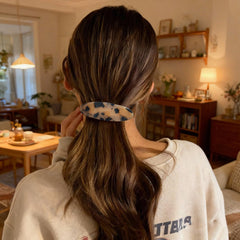 Markuii lifestyle shot outdoors wearing barrette for casual polished look