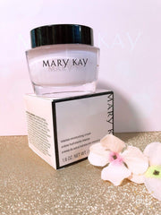Hand applying Mary Kay cream to cheek closeup, proves quick absorption and comfort