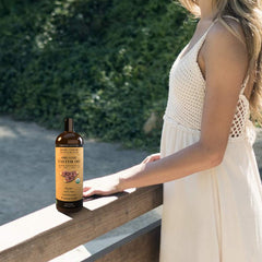 Mary Tylor Naturals oil pouring to show thick cold-pressed texture and nutrient preservation