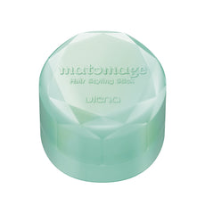Matomege UTENA beside a hand to show 13 g size and travel-ready benefit
