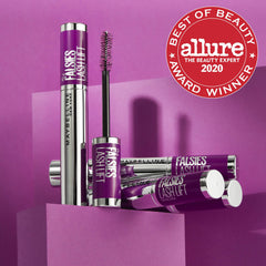 Maybelline color swatches on skin showing brownish-black tone