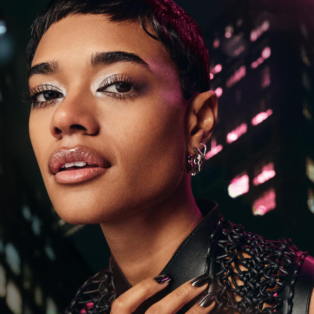 Maybelline Firework swatch on skin showing extra-black pigment and glossy finish