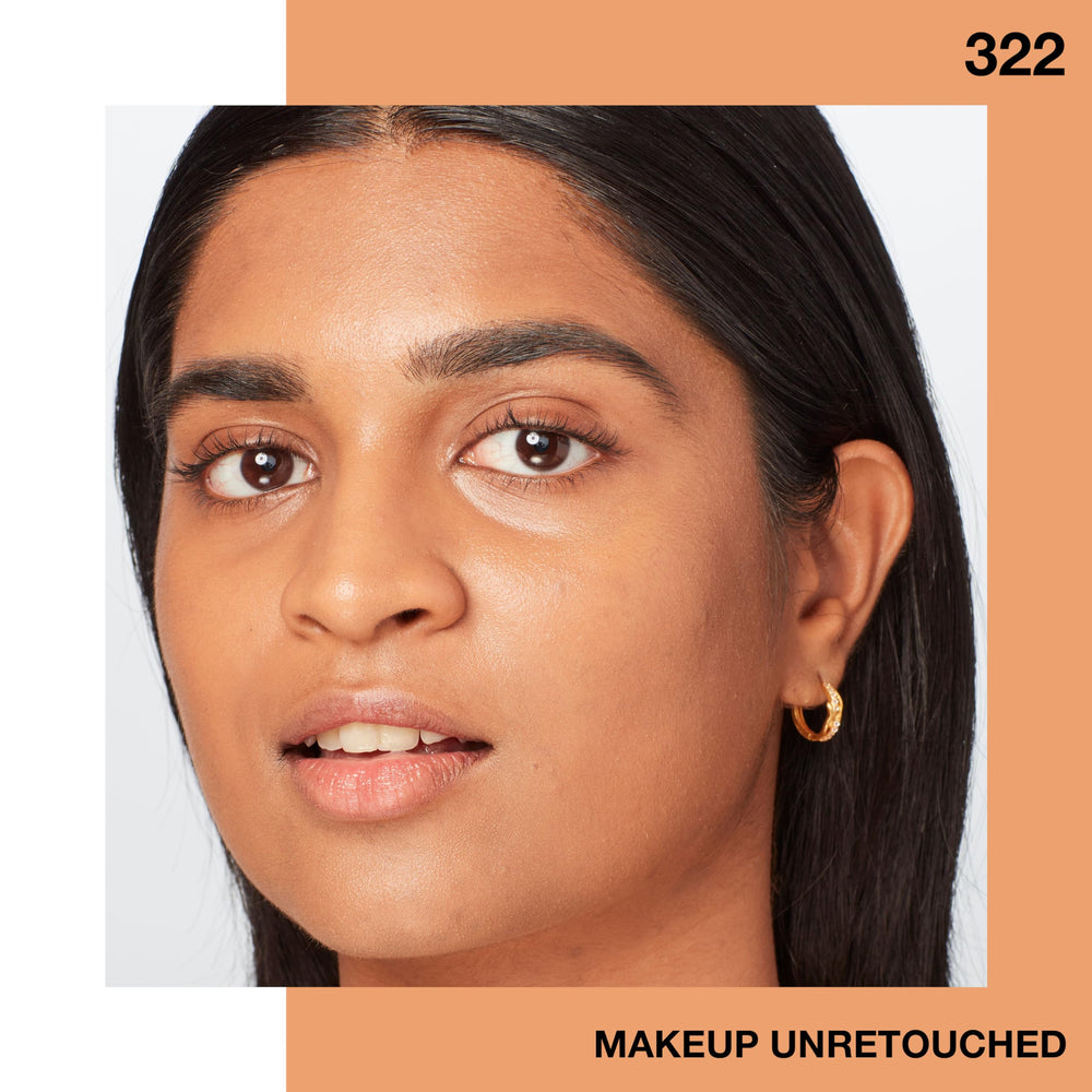 Maybelline Fit Me applied by woman in mirror showing luminous finish and natural glow