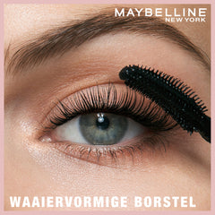 Maybelline Lash Sensational next to a ruler showing size and applicator cap
