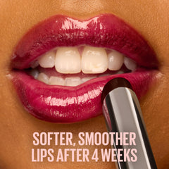 maybelline balm on lips in caramel glow showing sheer color and plumping effect