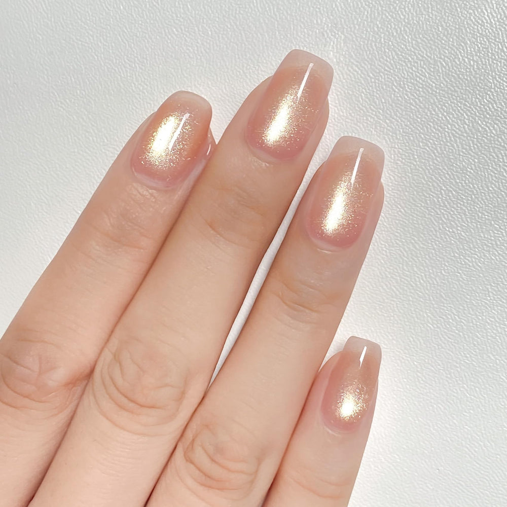 MAYCHAO ash blonde on model nails studio shot offering refined rose-gold finish