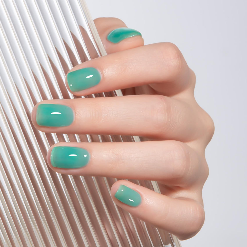 MAYCHAO glossy swatch close-up illustrating translucent aqua shine and depth