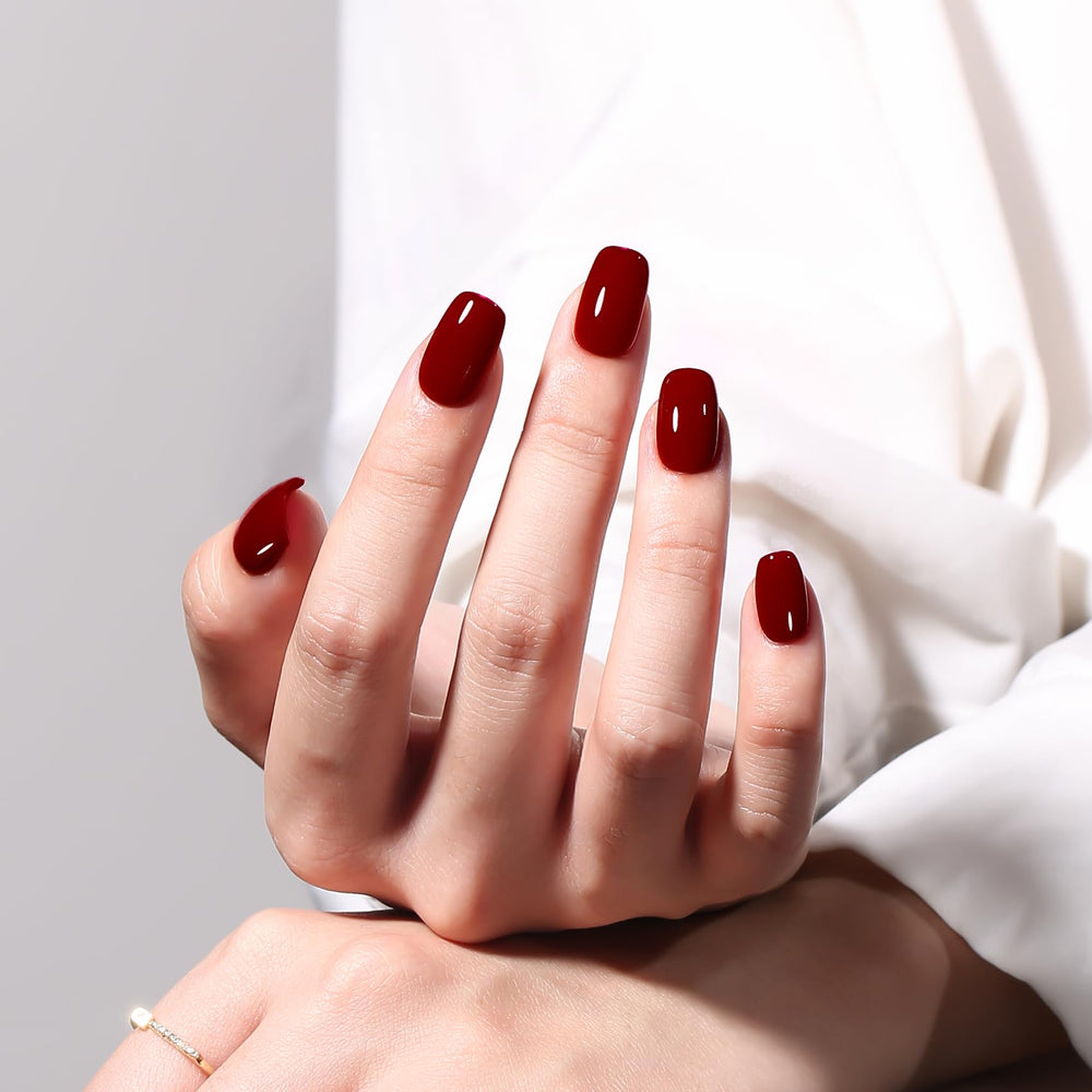 MAYCHAO being applied to a fingernail under lamp demonstrating professional finish benefit