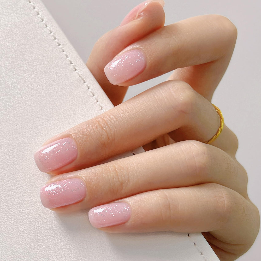 MAYCHAO swatch on nails displaying sheer pink sparkle and buildable finish