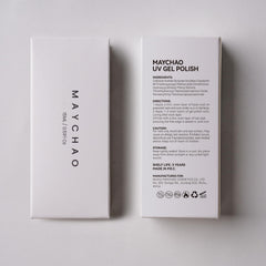 MAYCHAO bottle beside finished manicure in lifestyle setting showing salon-grade gloss benefit