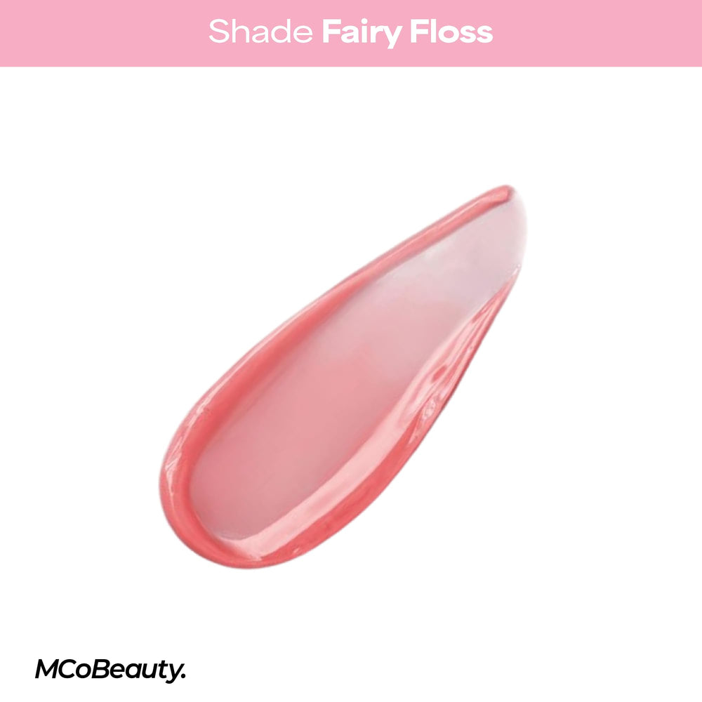 MCoBeauty Fairy Floss tube next to credit card showing compact, travel-friendly size