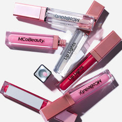 MCoBeauty gloss wand close-up demonstrating smooth applicator for even coverage