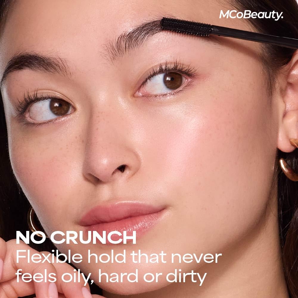 MCoBeauty tube next to lipstick to show compact size and grab-and-go convenience