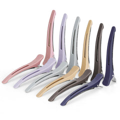 Medoca front view of twelve ashen duck billed clips, organized and ready for styling