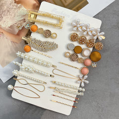 Mehayi pearl clip detail showcasing imitation pearls and elegant shine