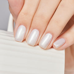 MEMEDA applied on nails in lifestyle shot showing durable glossy finish