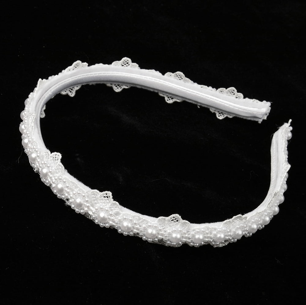 Merroyal headband worn for First Communion, complements formal attire