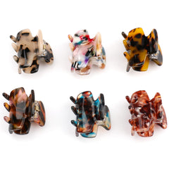 Messen clips in hand showing compact 1.4-inch size for easy handling