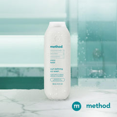 Method co‑wash on bathroom shelf in a lifestyle scene evoking tropical scent