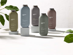 Method bottle styled on bathroom shelf suggesting sustainable grooming routine