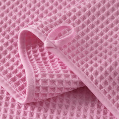 MICROFI towel held by hand showing 13x13 inch scale for easy facial coverage
