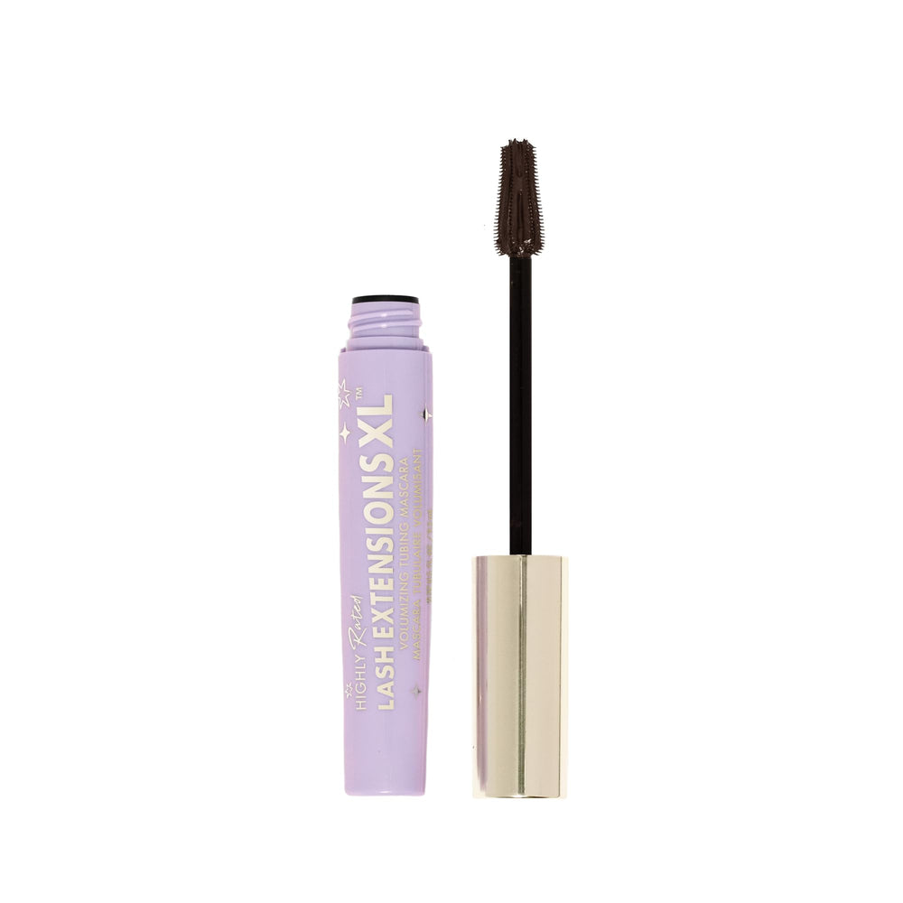 Milani mascara next to coin showing compact size and portability
