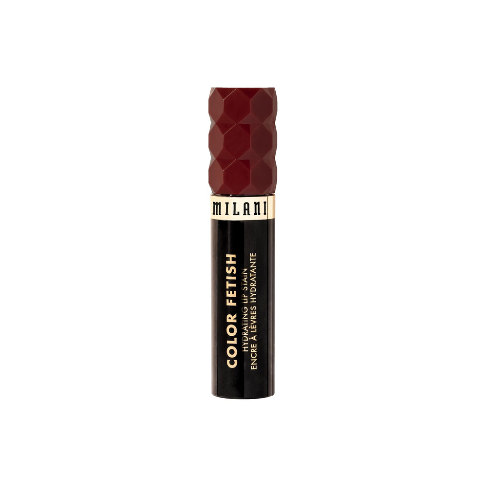 Milani tube next to hand to show size and easy purse portability