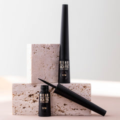 Milani eyeliner held in hand showing compact size and travel-friendly design