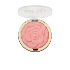 Milani Tea Rose beside a makeup bag showing travel-ready convenience