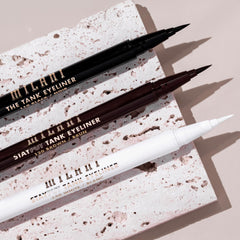 Milani The Tank single swiped stroke on white showing smooth brown pigment payoff