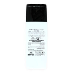 Milbon shampoo bottle on bathroom shelf staged to show salon-quality at-home repair