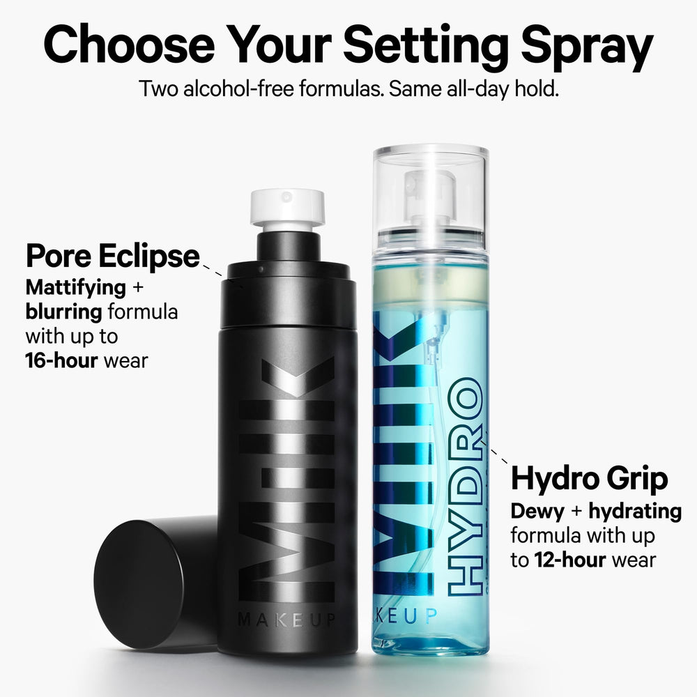Milk Makeup bottle on vanity with skincare props, conveys dewy radiance and daily routine use