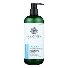 Mill Creek jojoba shampoo front label showing volume and benefits for balanced hydration