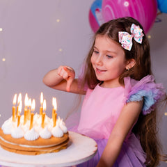 Miroksh bow worn in a girl’s hair demonstrating playful party styling