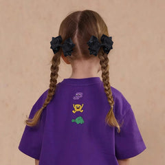 Miroksh bow clipped in ponytail adding instant shine and tidy look