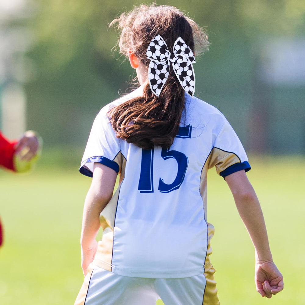 Miroksh bow worn in a ponytail highlighting visibility and comfortable wear during play