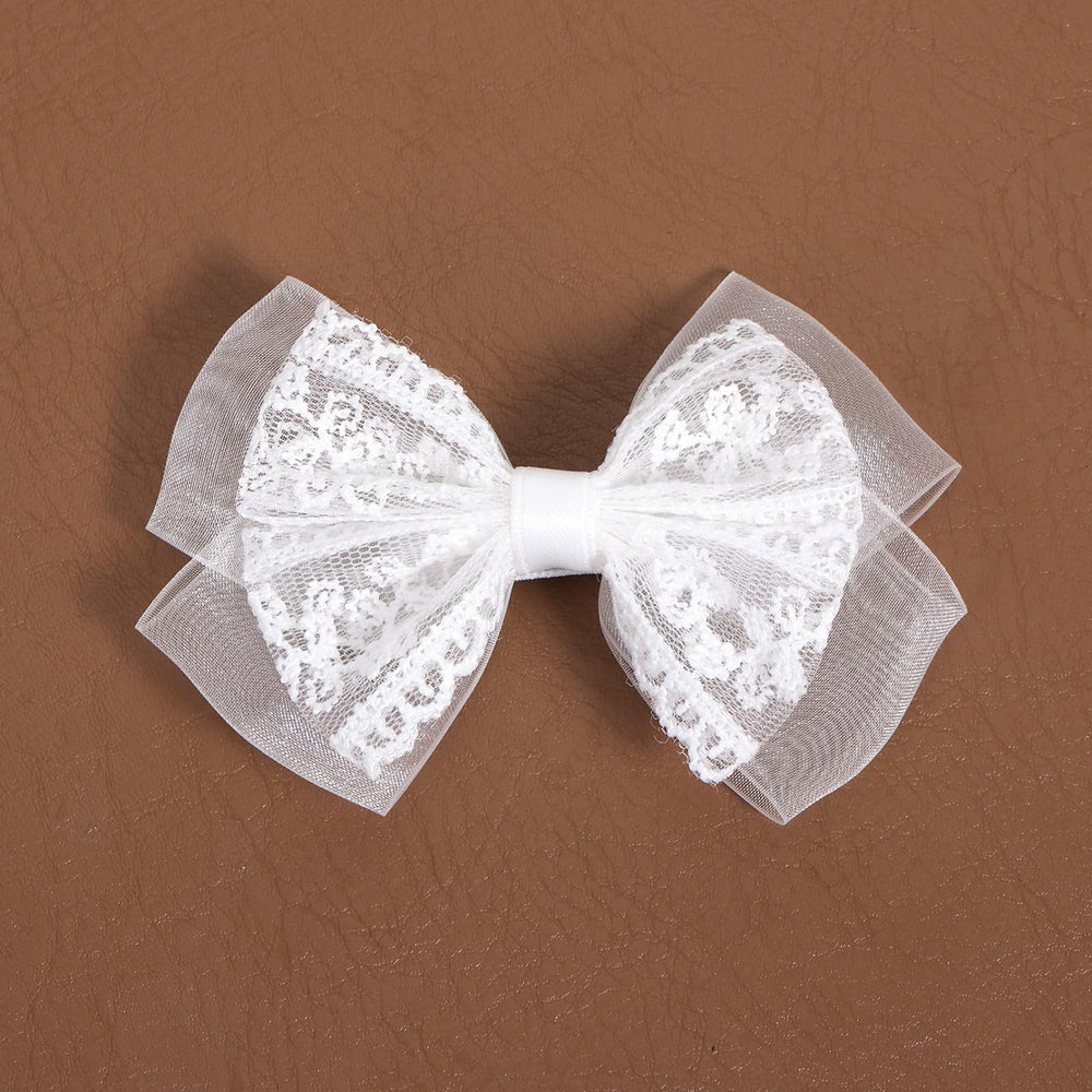 Miroksh bridal updo with bow showing decorative finish and photo-ready look