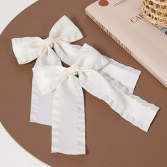 Miroksh close-up of ruffled satin texture highlighting soft sheen and refined edges