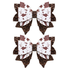 Miroksh front view of two glitter brown cow print bows showing size and shape, perfect party accent