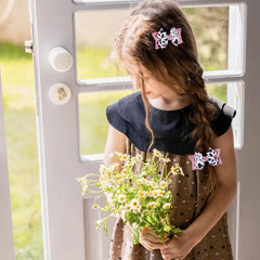 Miroksh girl wearing bow in ponytail demonstrating cute style and day-long wearability