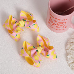 Miroksh lemon bow side detail highlighting ribbon texture and shape