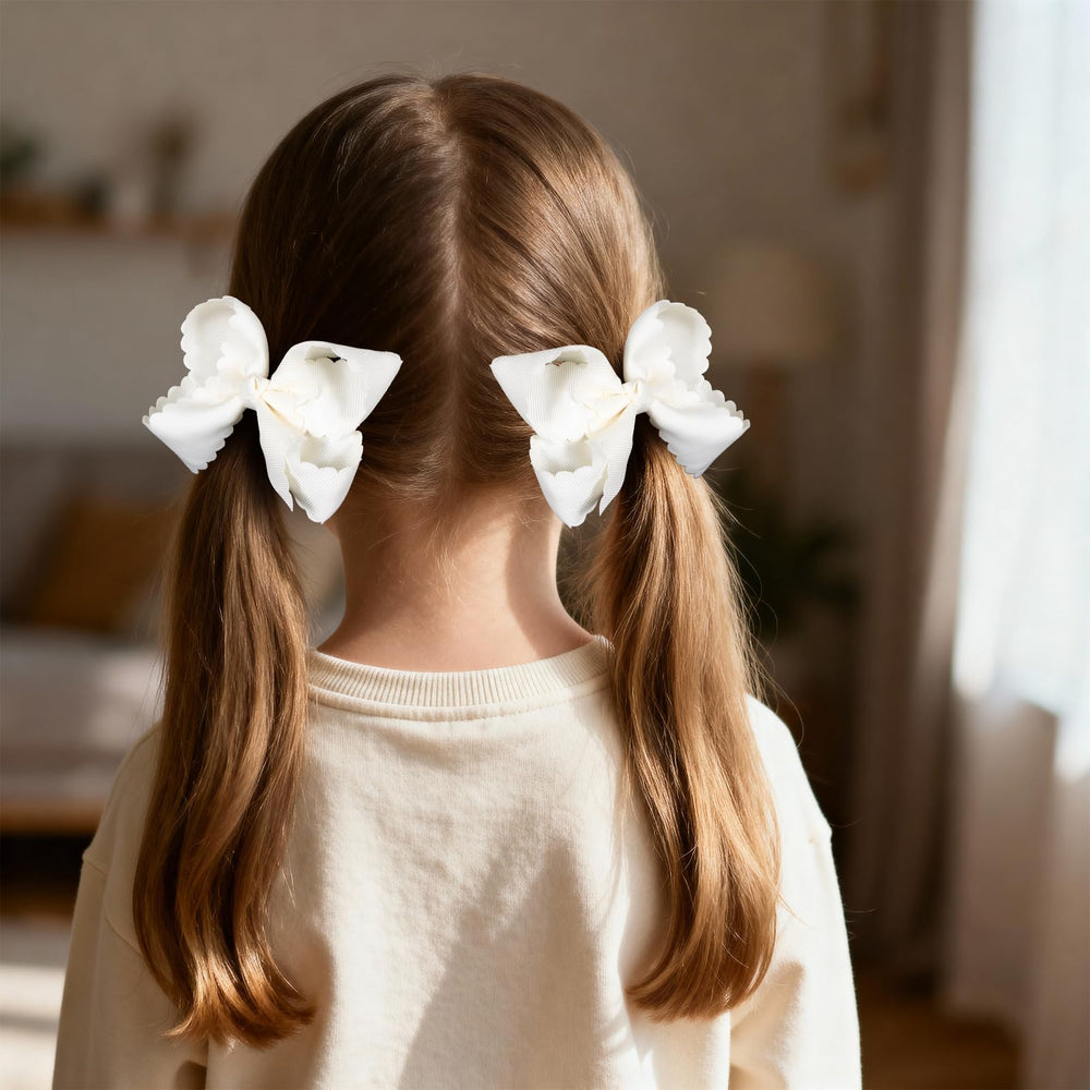 Miroksh bow in toddler pigtails securing hair and adding dressy charm