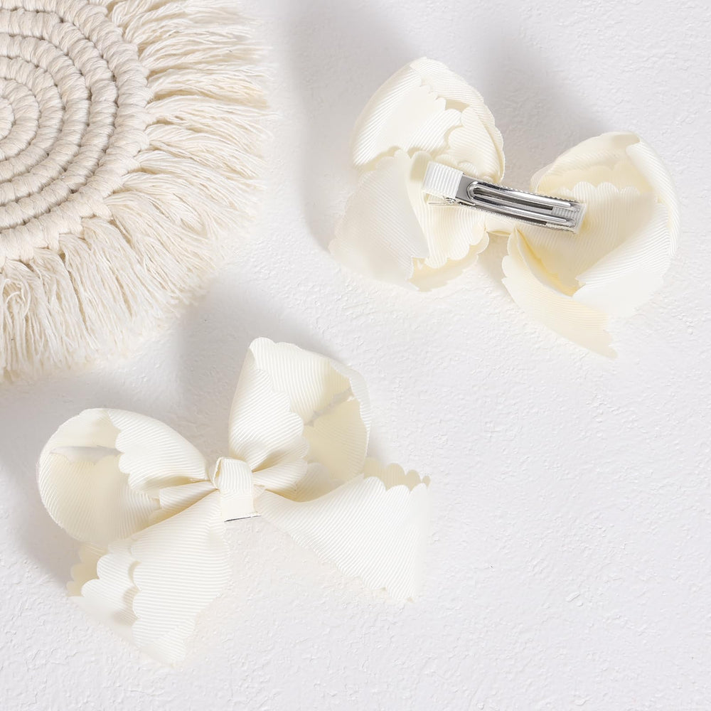 Miroksh scallop close-up highlighting grosgrain texture and polished edge