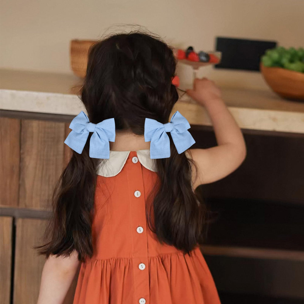 Miroksh bow worn on child ponytail showing pretty styling benefit